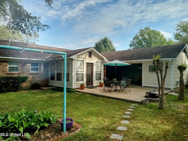701 W Gresham St, Indianola, MS 38751 - back of house featuring a patio and a yard