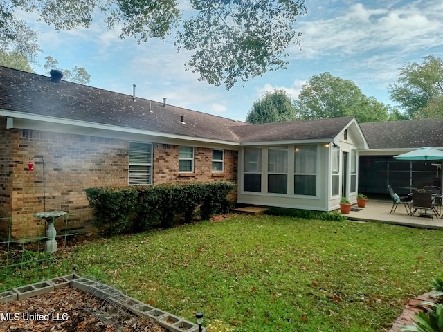 701 W Gresham St, Indianola, MS 38751 - back of house with a patio area, a yard, and a sunroom
