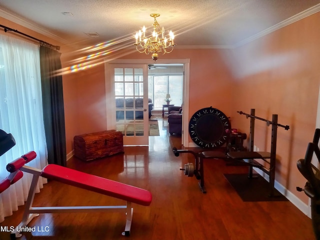 701 W Gresham St, Indianola, MS 38751 - workout room featuring hardwood / wood-style floors, a notable chandelier, ornamental molding, and a textured ceiling