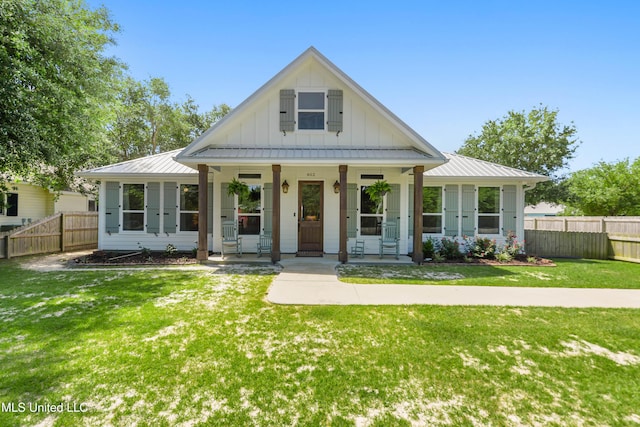 802 Old Spanish Trl, Bay Saint Louis, MS 39520 - modern farmhouse featuring board and batten siding, covered porch, and metal roof
