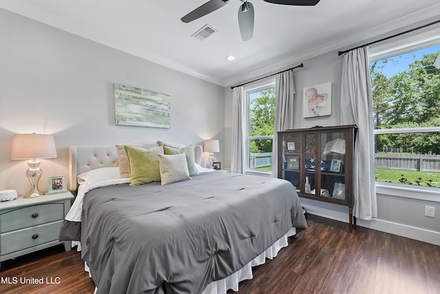 802 Old Spanish Trl, Bay Saint Louis, MS 39520 - bedroom featuring crown molding, dark wood-style flooring, a ceiling fan, and baseboards