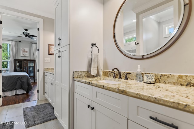 802 Old Spanish Trl, Bay Saint Louis, MS 39520 - bathroom featuring crown molding, vanity, connected bathroom, and a ceiling fan