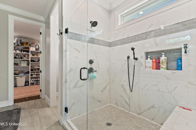 802 Old Spanish Trl, Bay Saint Louis, MS 39520 - bathroom featuring crown molding, a stall shower, and a spacious closet
