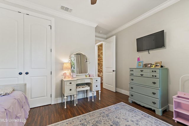 802 Old Spanish Trl, Bay Saint Louis, MS 39520 - bedroom with dark wood finished floors, ornamental molding, baseboards, a closet, and a ceiling fan