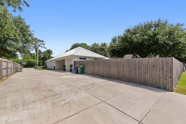 802 Old Spanish Trl, Bay Saint Louis, MS 39520 - view of home's exterior with concrete driveway and fence