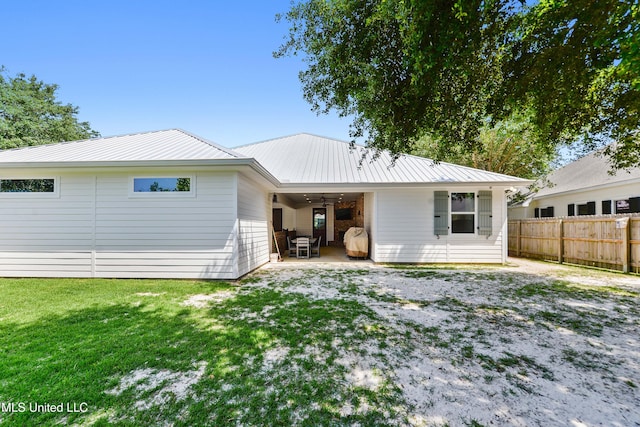 802 Old Spanish Trl, Bay Saint Louis, MS 39520 - back of house with a ceiling fan, metal roof, and a patio