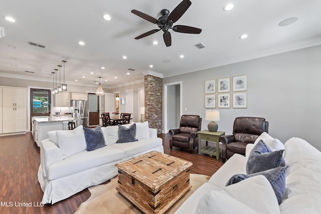 802 Old Spanish Trl, Bay Saint Louis, MS 39520 - living area with dark wood-style floors, recessed lighting, a ceiling fan, and ornamental molding