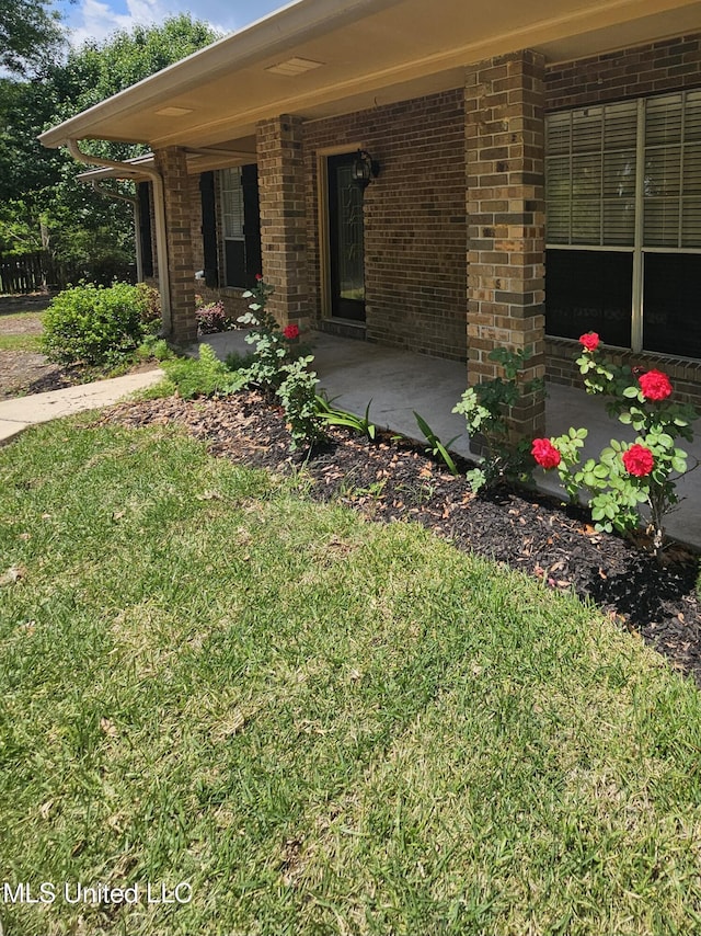 14162 E Marcie Rd, Gulfport, MS 39503 - property entrance with brick siding and a yard