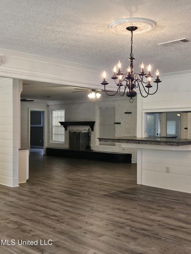 14162 E Marcie Rd, Gulfport, MS 39503 - interior space featuring ornamental molding, dark wood-style floors, a textured ceiling, and a chandelier