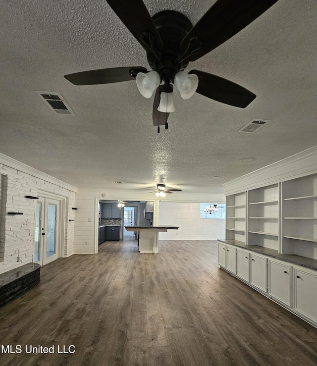 14162 E Marcie Rd, Gulfport, MS 39503 - unfurnished living room with visible vents, a textured ceiling, dark wood-style flooring, and ceiling fan with notable chandelier