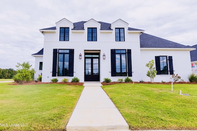 138 Genoa Dr, Madison, MS 39110 - view of front of home featuring a front yard, a shingled roof, and french doors