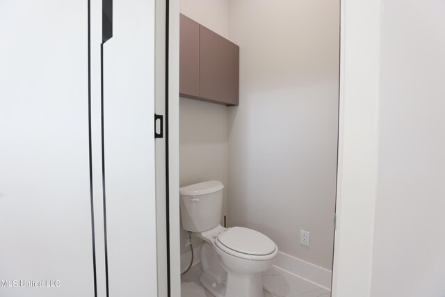 138 Genoa Dr, Madison, MS 39110 - bathroom featuring toilet, baseboards, and marble look tiles