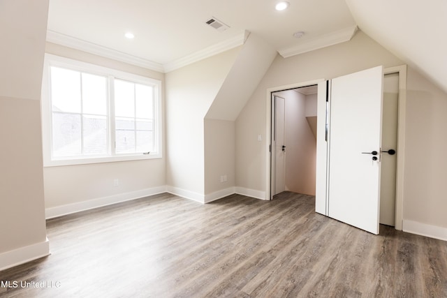 bonus room with vaulted ceiling and hardwood / wood-style flooring