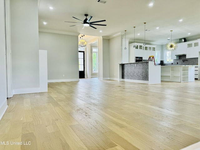 138 Genoa Dr, Madison, MS 39110 - unfurnished living room featuring crown molding, recessed lighting, ceiling fan, baseboards, and light wood finished floors