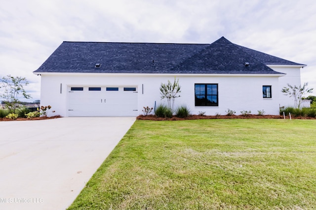 138 Genoa Dr, Madison, MS 39110 - view of front facade featuring concrete driveway, an attached garage, roof with shingles, and a front yard