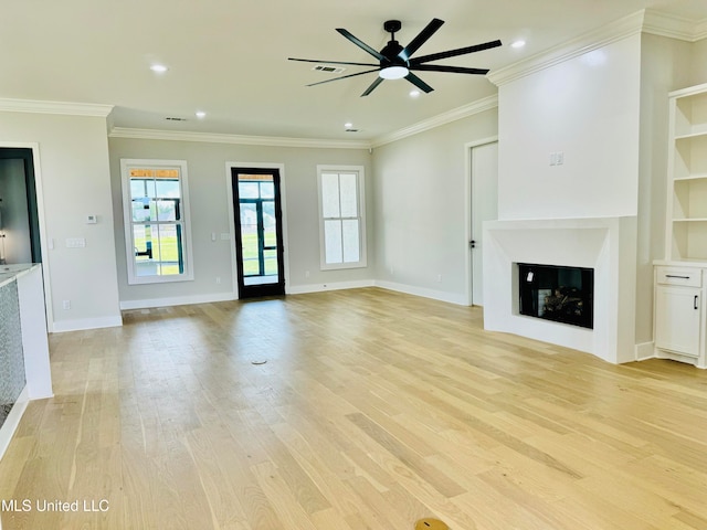 unfurnished living room featuring ornamental molding, light hardwood / wood-style floors, and ceiling fan