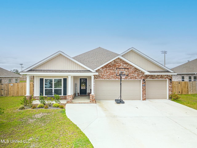 craftsman-style house with a garage, a porch, and a front yard