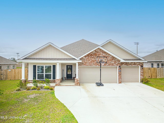 5251 Fairbury Way, Diberville, MS 39540 - view of front of property with a garage, brick siding, concrete driveway, and covered porch