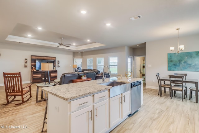 5251 Fairbury Way, Diberville, MS 39540 - kitchen with a sink, a raised ceiling, dishwasher, light wood finished floors, and recessed lighting