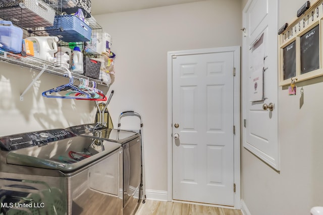 5251 Fairbury Way, Diberville, MS 39540 - laundry area with washer and dryer, wood finished floors, and baseboards