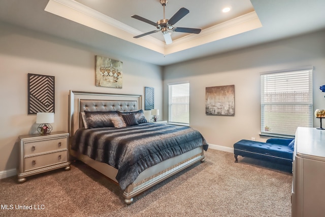 bedroom with carpet flooring, ceiling fan, a raised ceiling, and crown molding