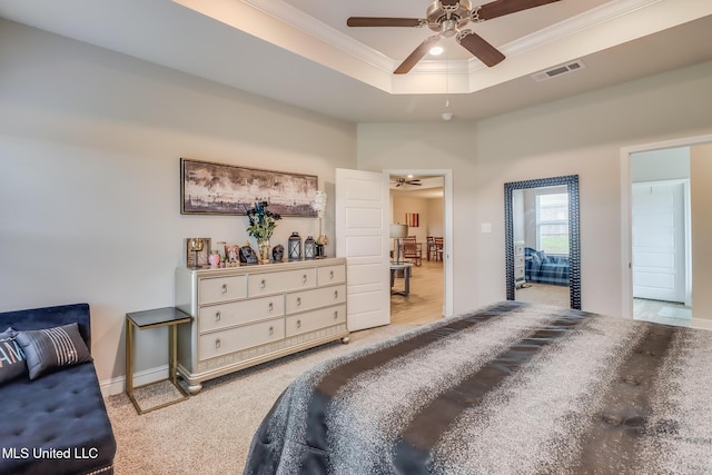 5251 Fairbury Way, Diberville, MS 39540 - bedroom with crown molding, carpet, a tray ceiling, baseboards, and a ceiling fan