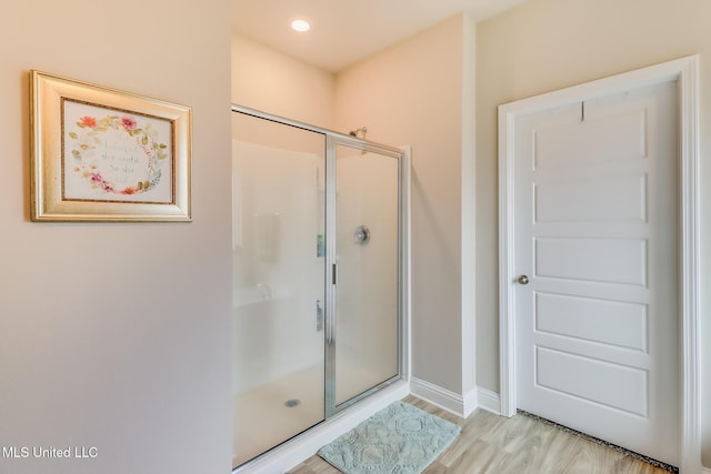 5251 Fairbury Way, Diberville, MS 39540 - bathroom featuring a shower stall, baseboards, and wood finished floors