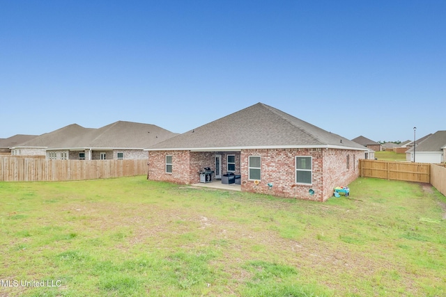 5251 Fairbury Way, Diberville, MS 39540 - rear view of house with brick siding, a patio area, and roof with shingles