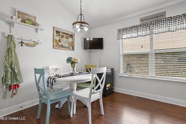 13703 Windwood Dr, Gulfport, MS 39503 - dining space featuring baseboards, wood finished floors, and vaulted ceiling