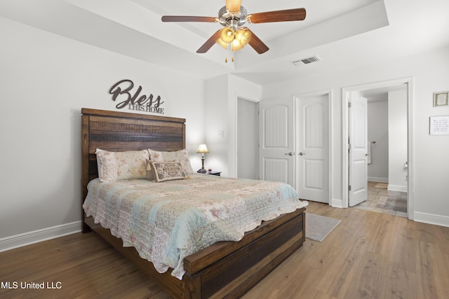 13703 Windwood Dr, Gulfport, MS 39503 - bedroom featuring baseboards, wood finished floors, a closet, and ceiling fan