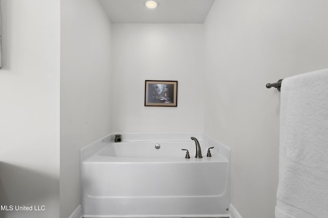 13703 Windwood Dr, Gulfport, MS 39503 - bathroom featuring a bath and baseboards