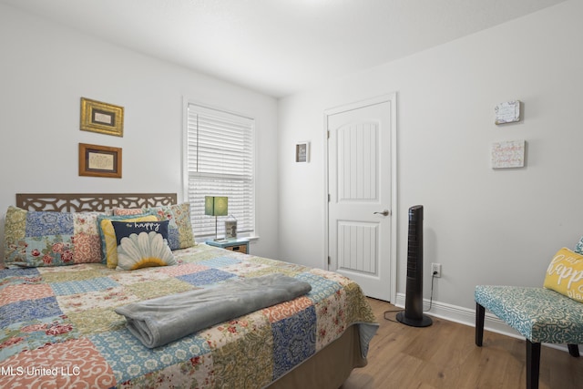13703 Windwood Dr, Gulfport, MS 39503 - bedroom featuring wood finished floors and baseboards