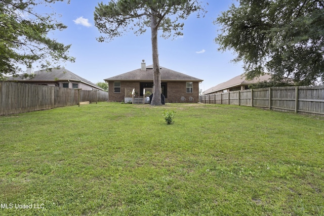 13703 Windwood Dr, Gulfport, MS 39503 - rear view of house featuring brick siding and a chimney