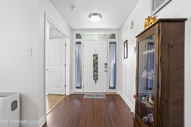 13703 Windwood Dr, Gulfport, MS 39503 - entrance foyer featuring baseboards, wood finished floors, and a textured ceiling