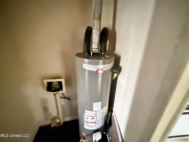 utility room with gas water heater