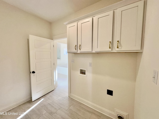 laundry room featuring washer hookup and cabinets