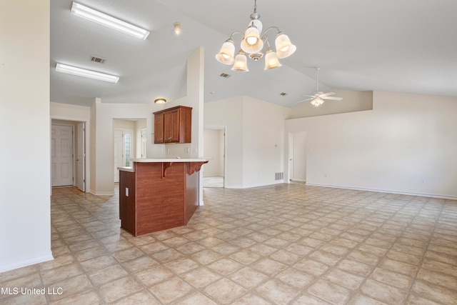 kitchen with a kitchen breakfast bar, hanging light fixtures, high vaulted ceiling, and ceiling fan with notable chandelier