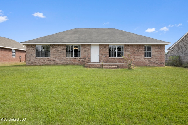 back of house with a yard