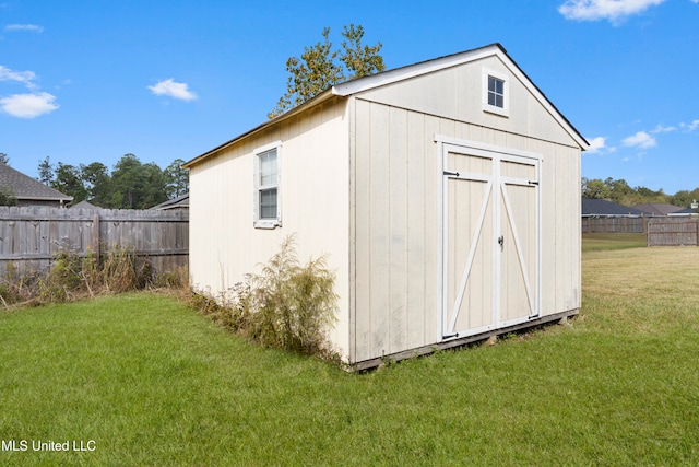 view of outdoor structure with a lawn