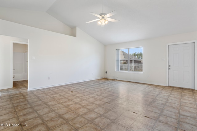 spare room with high vaulted ceiling and ceiling fan