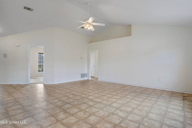 unfurnished room with ceiling fan and high vaulted ceiling