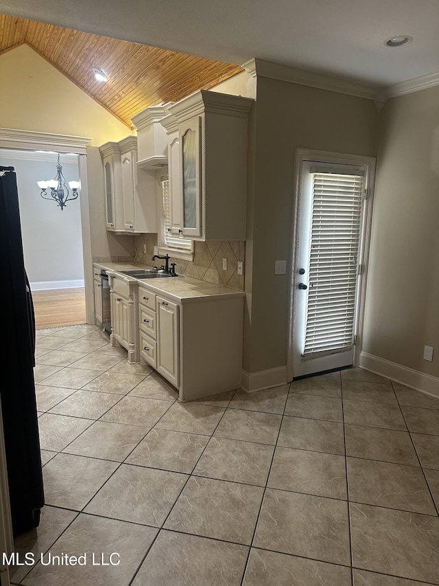 423 Grant Fox Dr, Brandon, MS 39047 - kitchen featuring freestanding refrigerator, wood ceiling, light countertops, a chandelier, and a sink