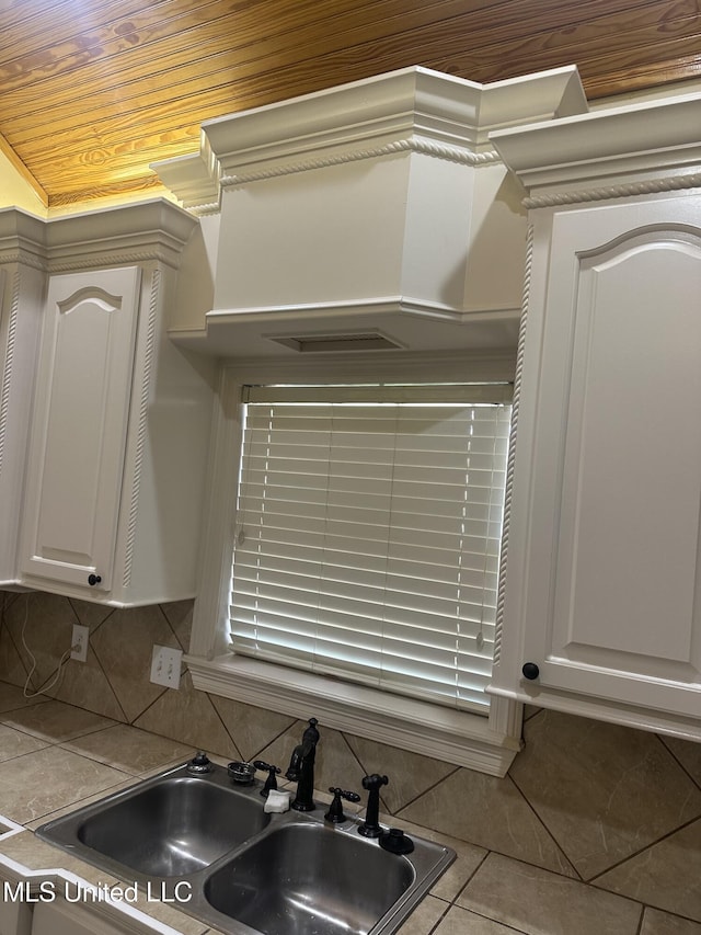 423 Grant Fox Dr, Brandon, MS 39047 - kitchen view of a sink, tasteful backsplash, and white cabinetry