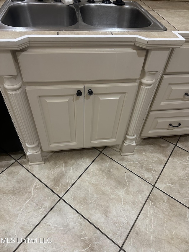 423 Grant Fox Dr, Brandon, MS 39047 - kitchen view of a sink, white cabinetry, and light countertops