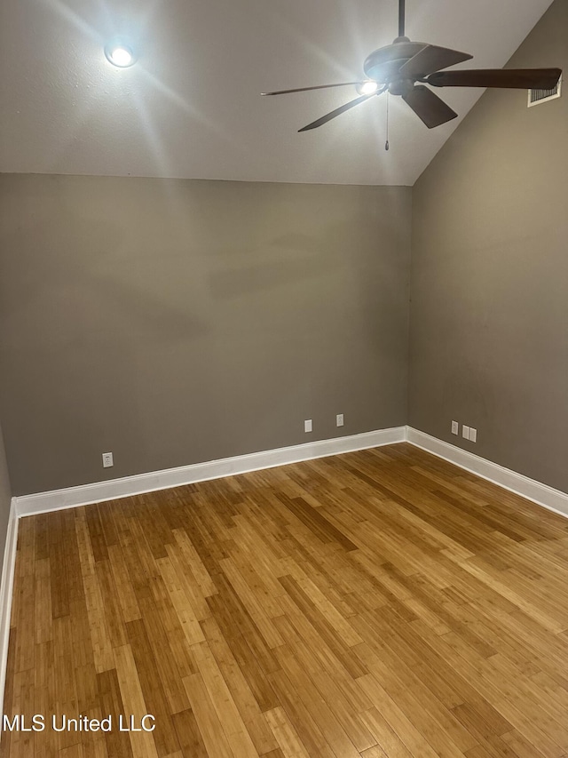 423 Grant Fox Dr, Brandon, MS 39047 - empty room with lofted ceiling, a ceiling fan, wood finished floors, and baseboards