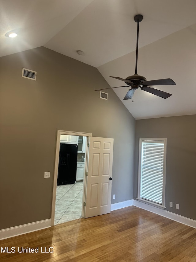 423 Grant Fox Dr, Brandon, MS 39047 - empty room with ceiling fan, high vaulted ceiling, light wood-style flooring, and baseboards