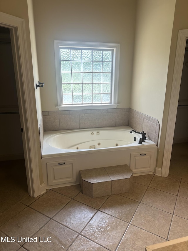 423 Grant Fox Dr, Brandon, MS 39047 - bathroom featuring a whirlpool tub and tile patterned floors