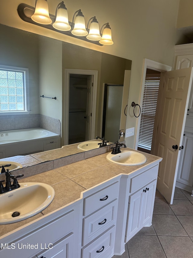 423 Grant Fox Dr, Brandon, MS 39047 - full bath featuring tile patterned floors, double vanity, and a garden tub