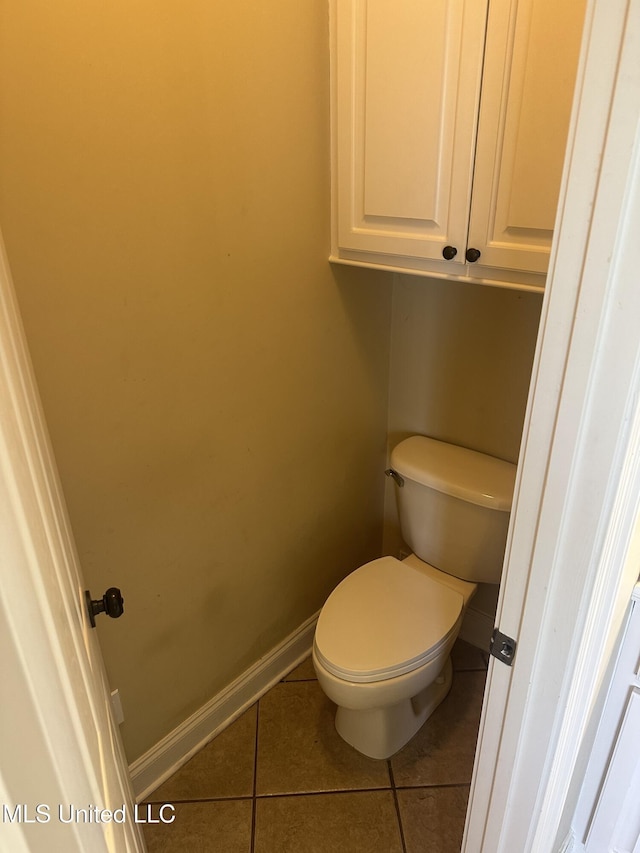 423 Grant Fox Dr, Brandon, MS 39047 - bathroom featuring tile patterned floors, toilet, and baseboards