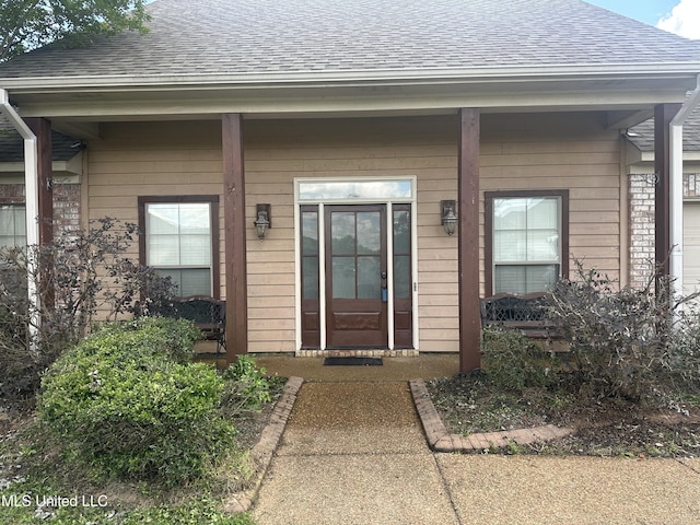423 Grant Fox Dr, Brandon, MS 39047 - doorway to property featuring roof with shingles and a porch